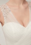 Robe de mariée bretelles transparentes perlées 